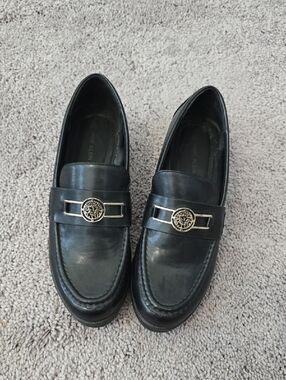 Anne Klein Black Leather Slip-On Loafers with Silver Emblem